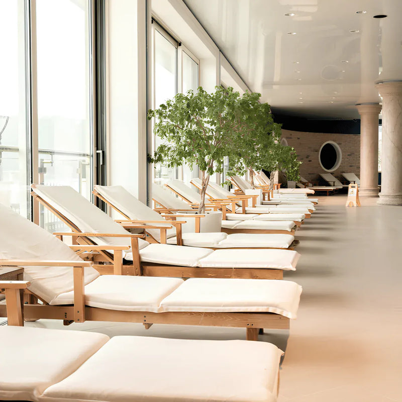 Modern wellness center with lounge chairs in a bright recovery and relaxation area.