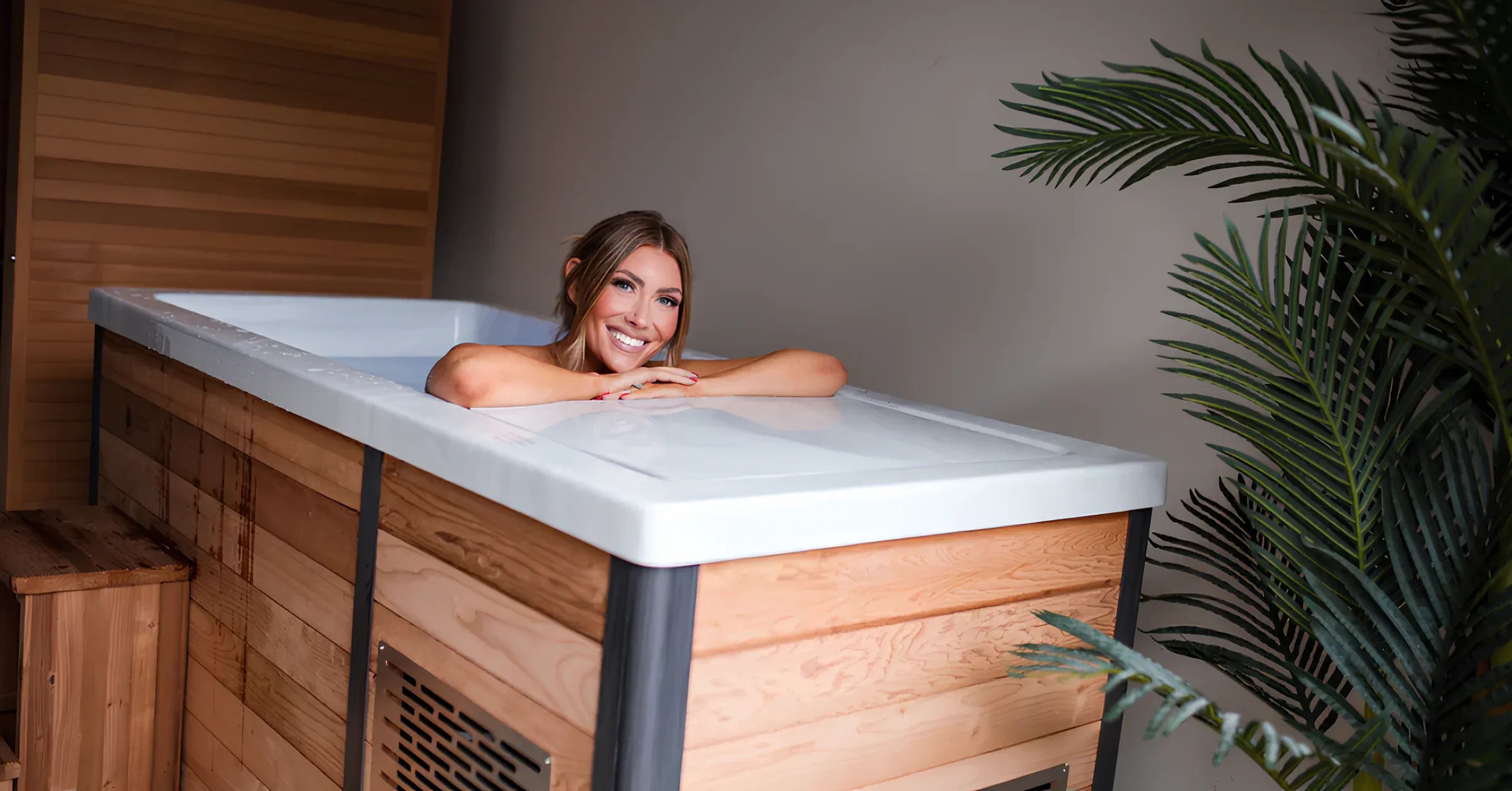 Image of person experiencing a cold plunge in a modern wellness setting.