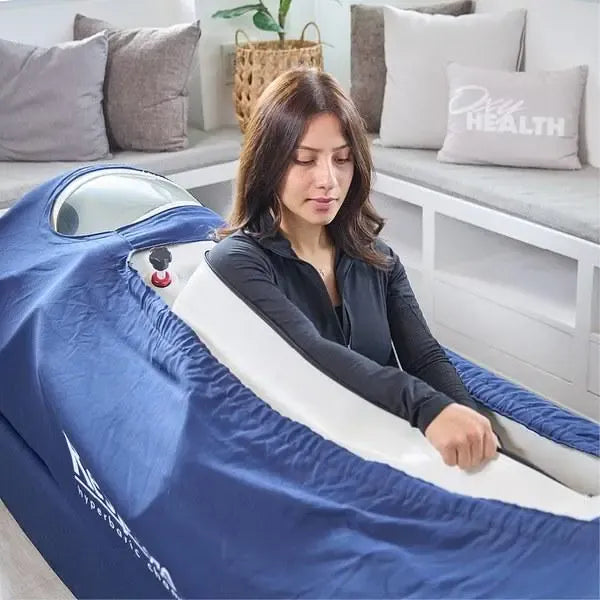 The OxyHealth Respiro 270® soft chamber shown inflated and ready for hyperbaric oxygen therapy inside a home room.