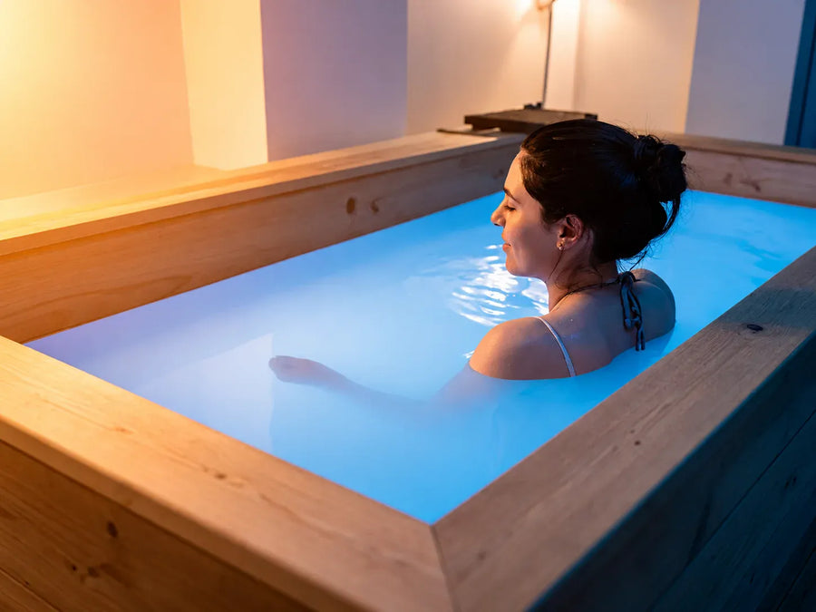 Image of person alternating between sauna heat and cold plunge therapy.