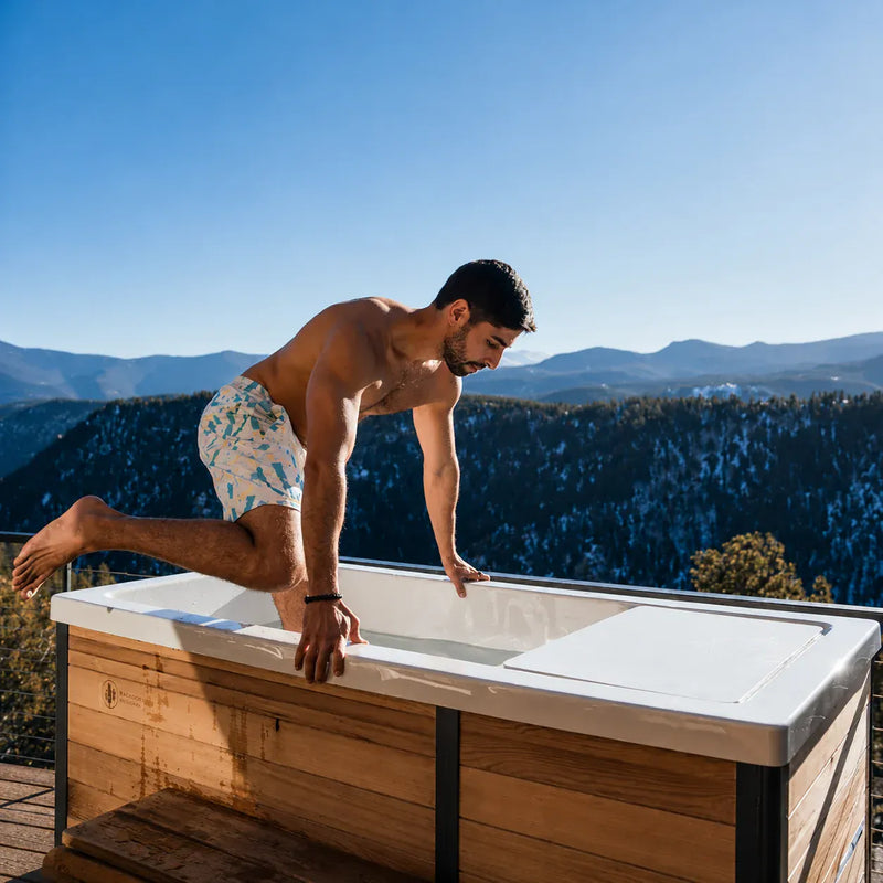 Image of person entering a cold plunge tub as part of a sports medicine plan.