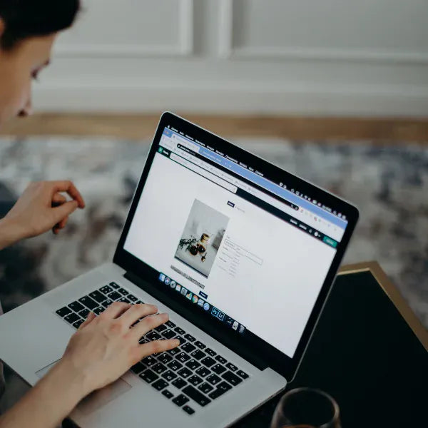 Image of a person picking a product in a showcase or display.