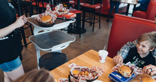 Servi service robot by Bear Robotics helping to run food to a table, who could run food at your restaurant as well.