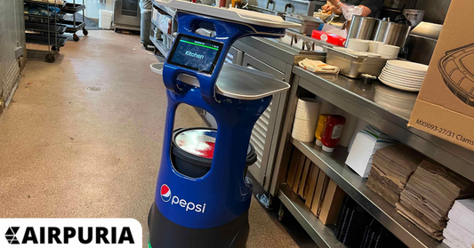 Server robots - A Servi robot waiter waiting to serve guests in the dining room.