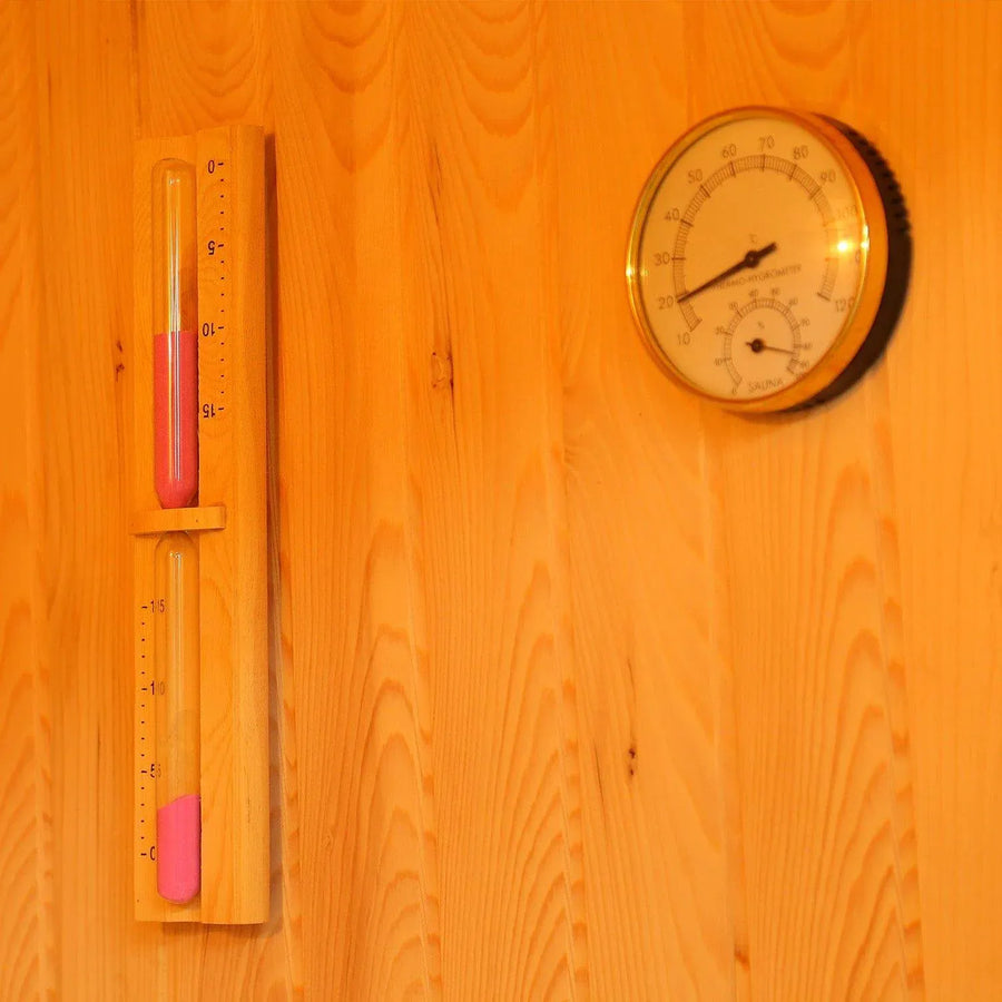 Thermometer and hygrometer mounted inside a traditional 2-person sauna.